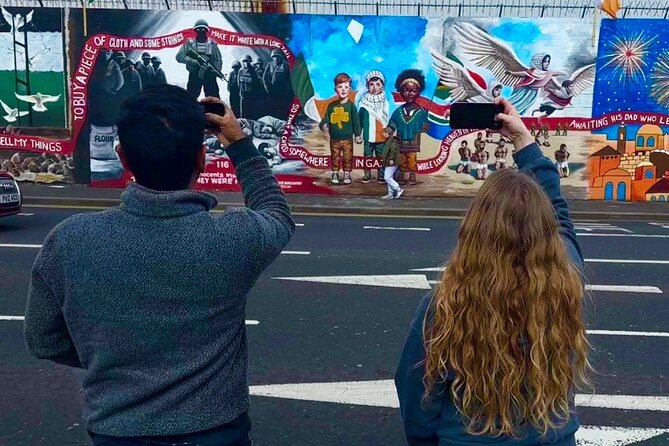 2 Hour Private Belfast Taxi Cab Tour of Troubles & Peace walls - International Mural Wall on Divis Street and the “Other Countries” Layer