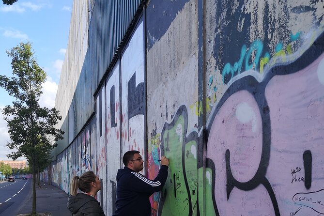 Belfast black taxi tours - Stop 1: International Mural Wall on Divis Street (15 minutes, free)