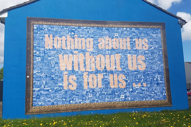 Belfast Troubles Murals Street Art and Peace Wall Walking Tour - International Mural Wall on Divis Street: causes beyond Belfast