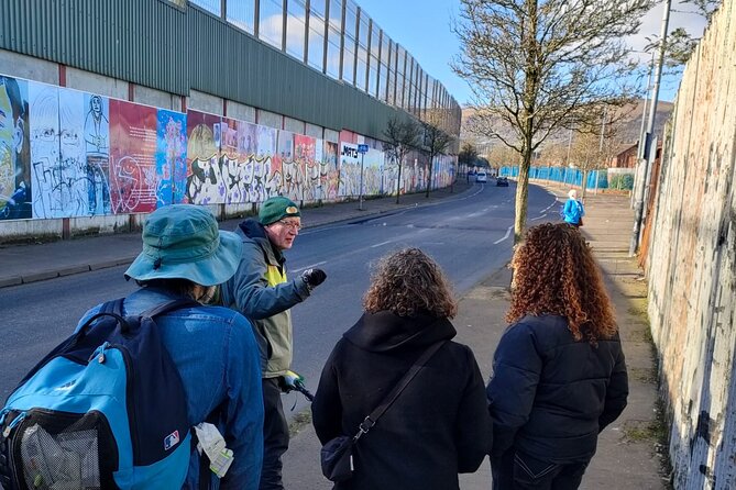 Belfast Troubles Tour: Walls and Bridges - International Wall of Murals near the Peace Walls: messages in paint