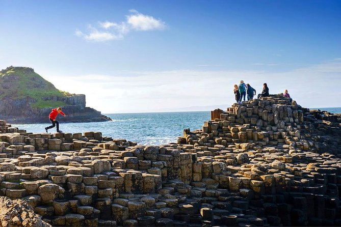 Giant's Causeway and more including Titanic Experience Ticket Tour from Belfast - Dunluce Castle ruins and North Atlantic Coast photo stops