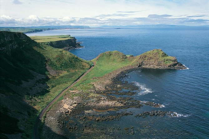 Giant's Causeway and Whisky Distillery tasting tour from Belfast - Dunluce Castle ruins: the 5-minute photo stop with real impact