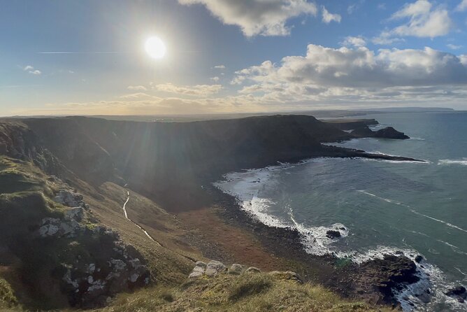 Giants Causeway Tour from Belfast + FREE Belfast Mural Tour - Ballintoy Harbour and Dunluce Castle: Game of Thrones scenery with real sea air